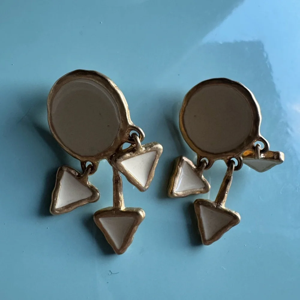 Vintage cream enamel and gold tone clip on dangle earrings